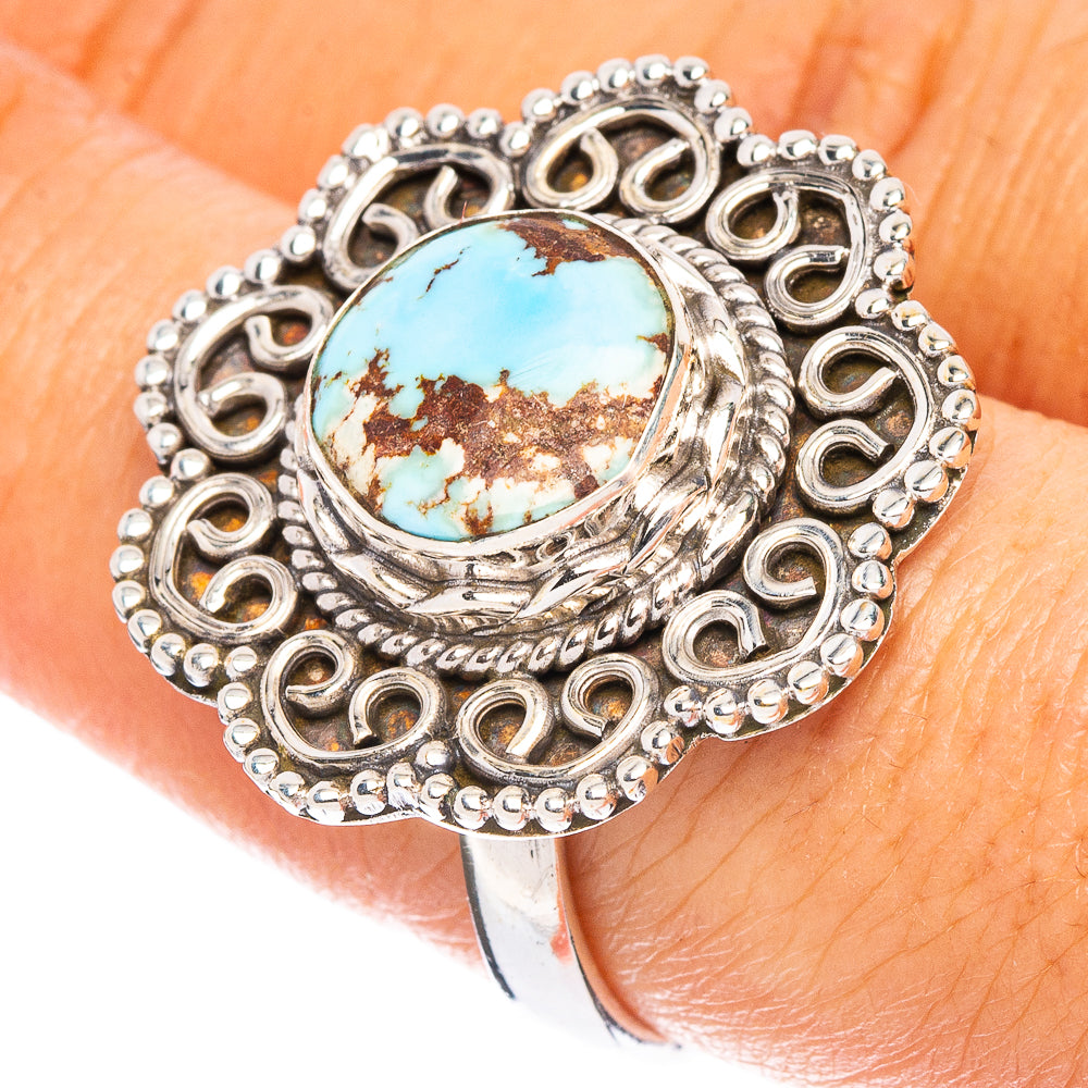 Turquoise cabochon sterling silver ring with ornate circular bezel