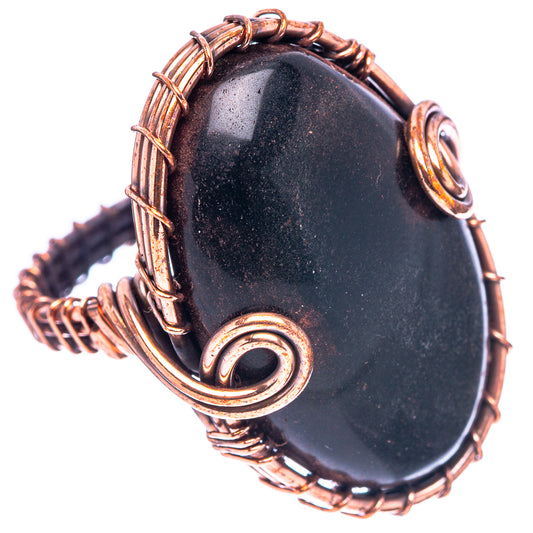 Oxidized copper wire ring with oval black jet stone, swirl bezel detail