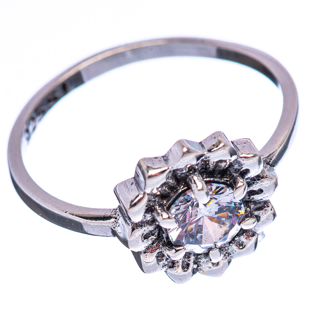 Sterling silver cubic zirconia ring with round center stone and clustered halos