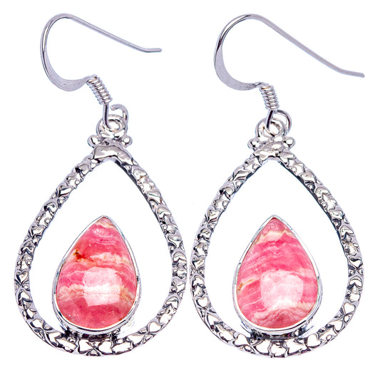 Sterling silver teardrop earrings with pink rhodochrosite centers and textured hoop border.