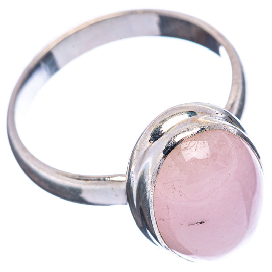 Oval pink kunzite cabochon set in .925 sterling silver band, ring size 7.75