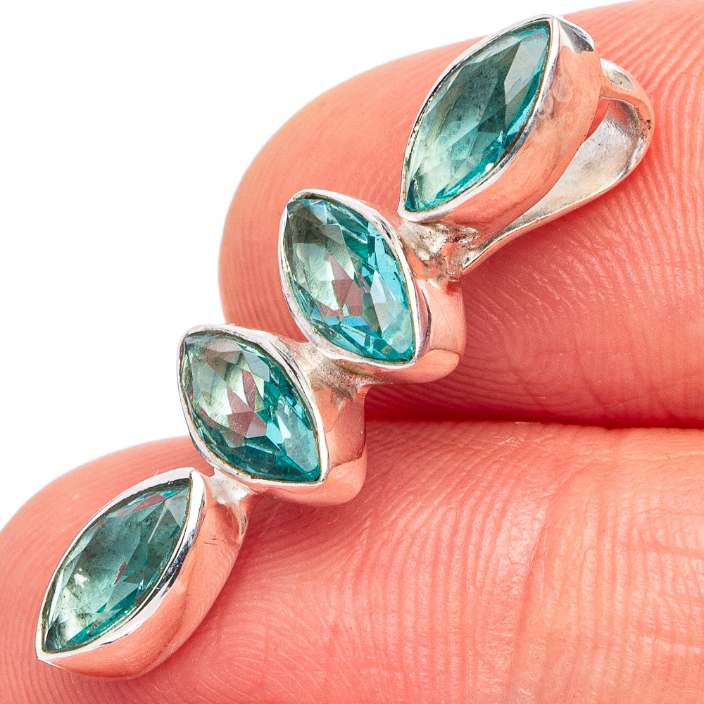 Sterling silver pendant with oval blue-green gemstones in prong settings