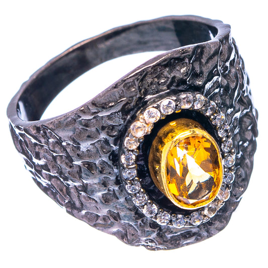 Black rhodium plated ring with textured band, yellow citrine oval center, crystal halo
