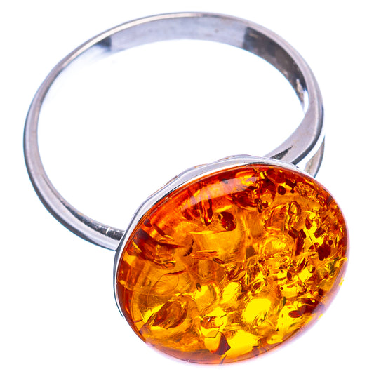 Silver ring with large oval amber cabochon and polished band
