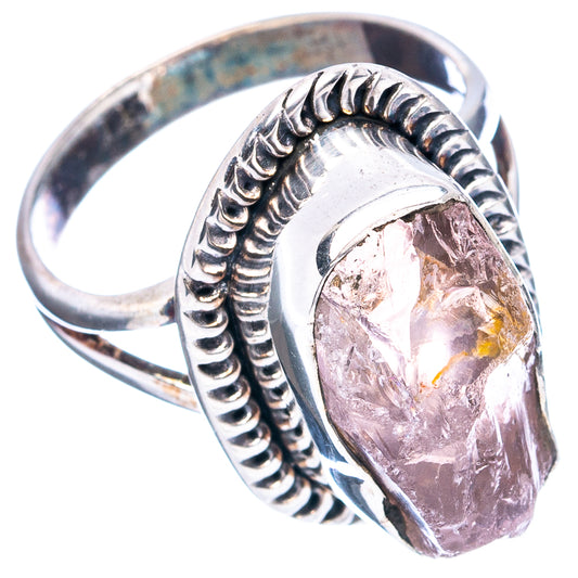 Rose quartz sterling silver ring with oval pink faceted stone and ridged silver setting