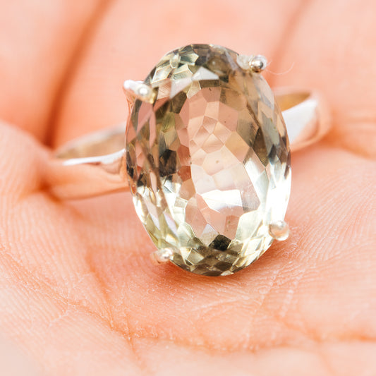 Oval prasiolite ring with four prongs on .925 sterling silver band