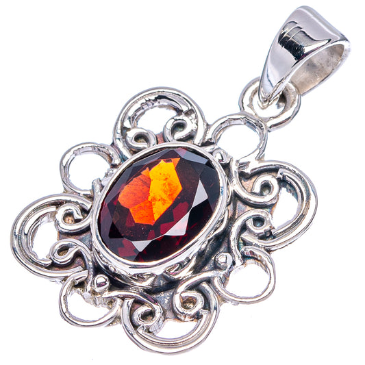 Oval garnet pendant in .925 sterling silver with red faceted stone and scroll filigree bail