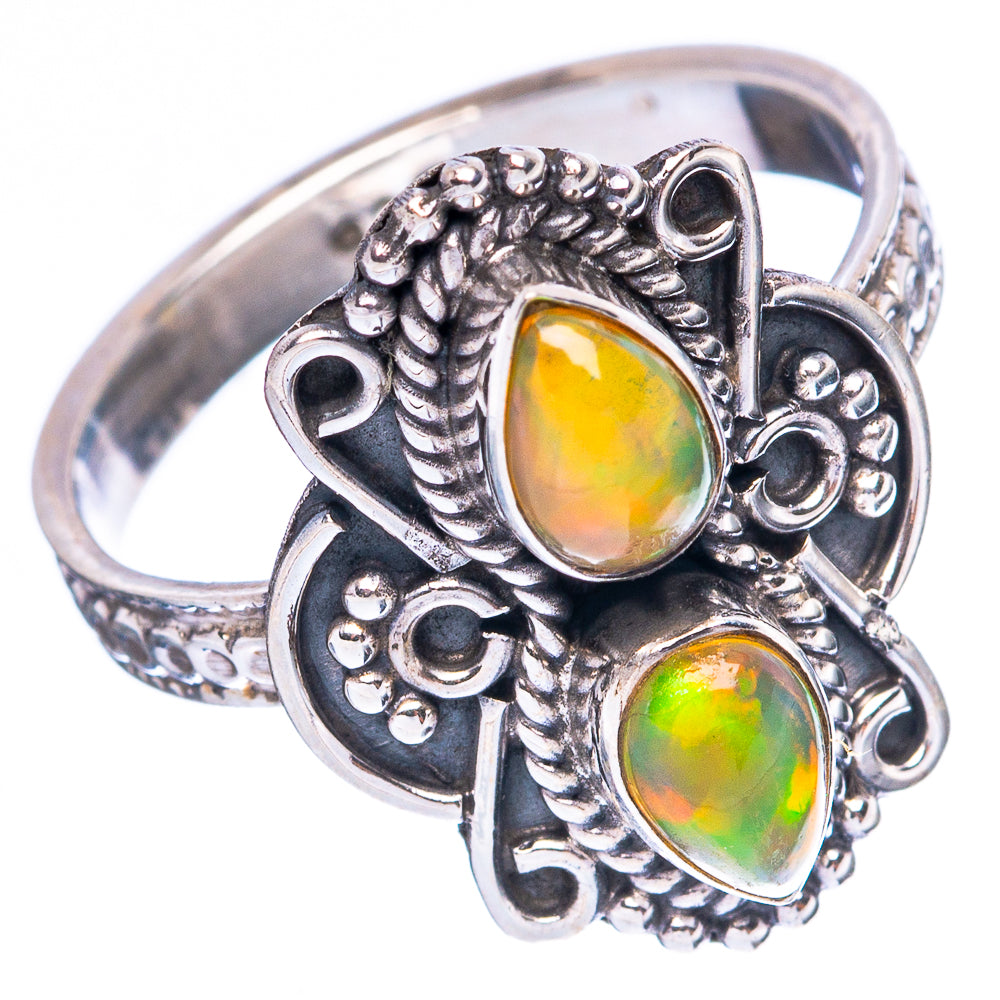 Sterling silver opal ring with two oval cabochon stones and ornate filigree settings