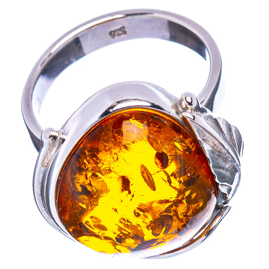 Adjustable amber ring with oval yellow-orange gemstone in .925 sterling silver band