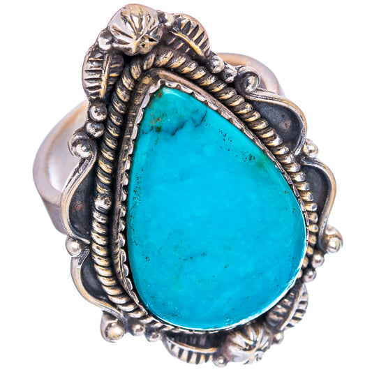 Turquoise teardrop sterling silver ring on finger with engraved side details
