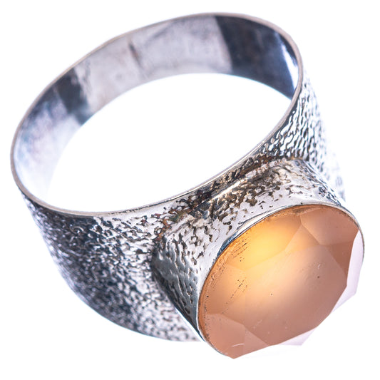 Sterling silver moonstone ring, side view, peach oval cabochon on hammered band