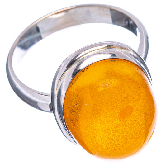 Sterling silver amber cabochon ring, oval yellow stone in raised bezel