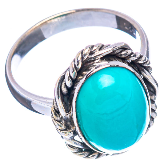 Turquoise oval cabochon sterling silver ring, ornate leaf-and-rope frame, side view