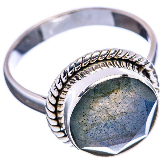 Sterling silver labradorite ring with faceted green-blue stone and twisted edge band