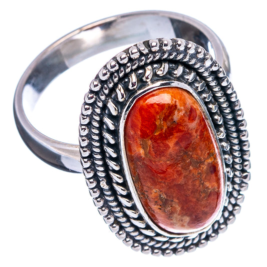 Sterling silver coral ring, oval orange cabochon with rope-texture border