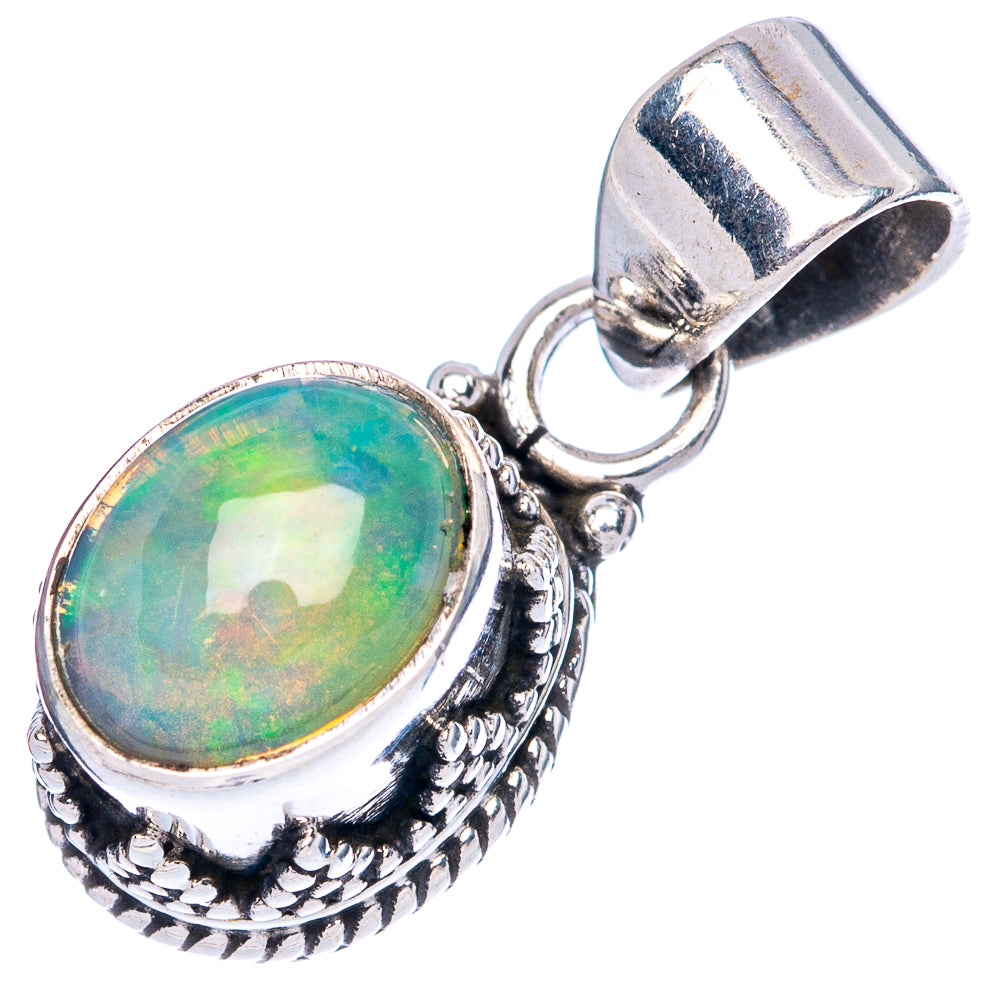 Oval Ethiopian opal pendant, silver bezel and detailed patterned frame with bail