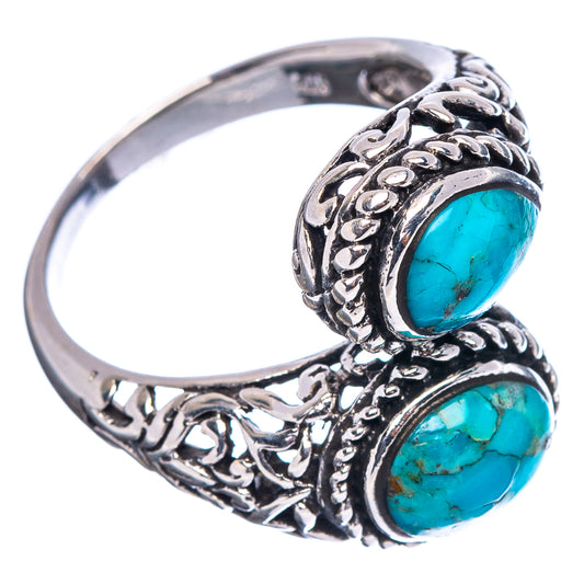 Sterling silver ring with two turquoise oval stones and detailed filigree band