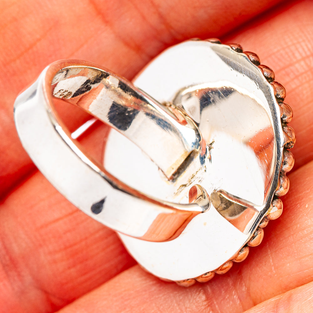 Sterling silver ring side view with prong setting and textured bead detail