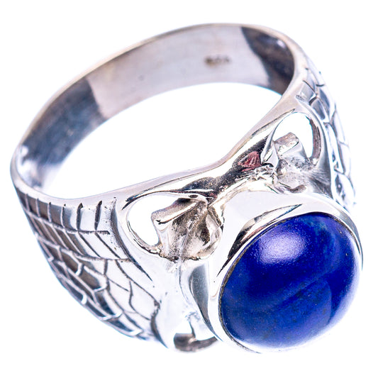 Sterling silver ring with oval blue lapis cabochon and engraved filigree pattern