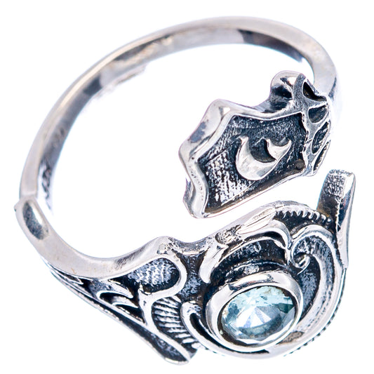 Dainty sterling silver adjustable ring with blue gemstone center and ornate filigree