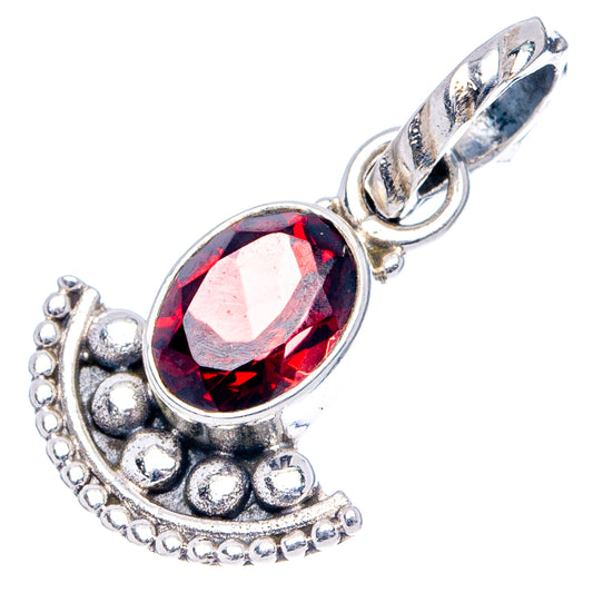 Red garnet oval pendant with ornate sterling silver frame and loop bail