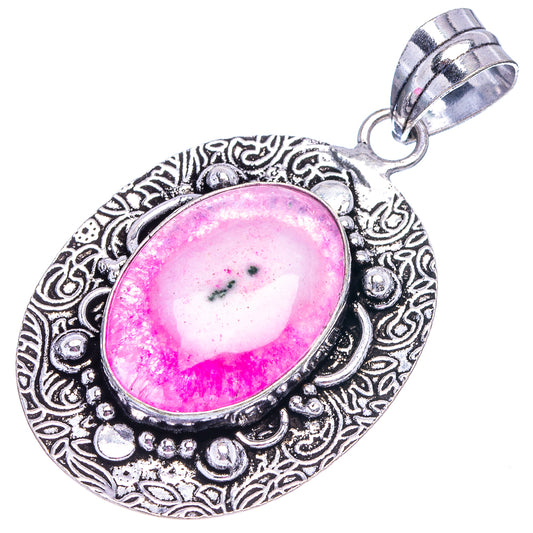 Pink solar quartz pendant with oval pink gemstone in ornate German silver frame