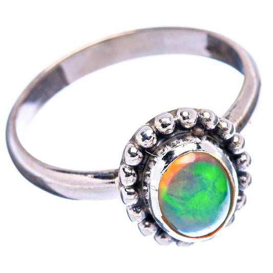 Sterling silver opal ring, round green-orange opal bezel with raised bead detail