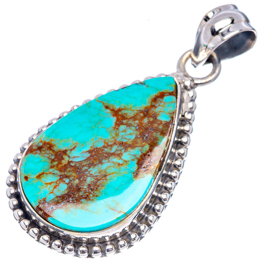 Turquoise teardrop pendant with textured silver beaded rim and hinge bail