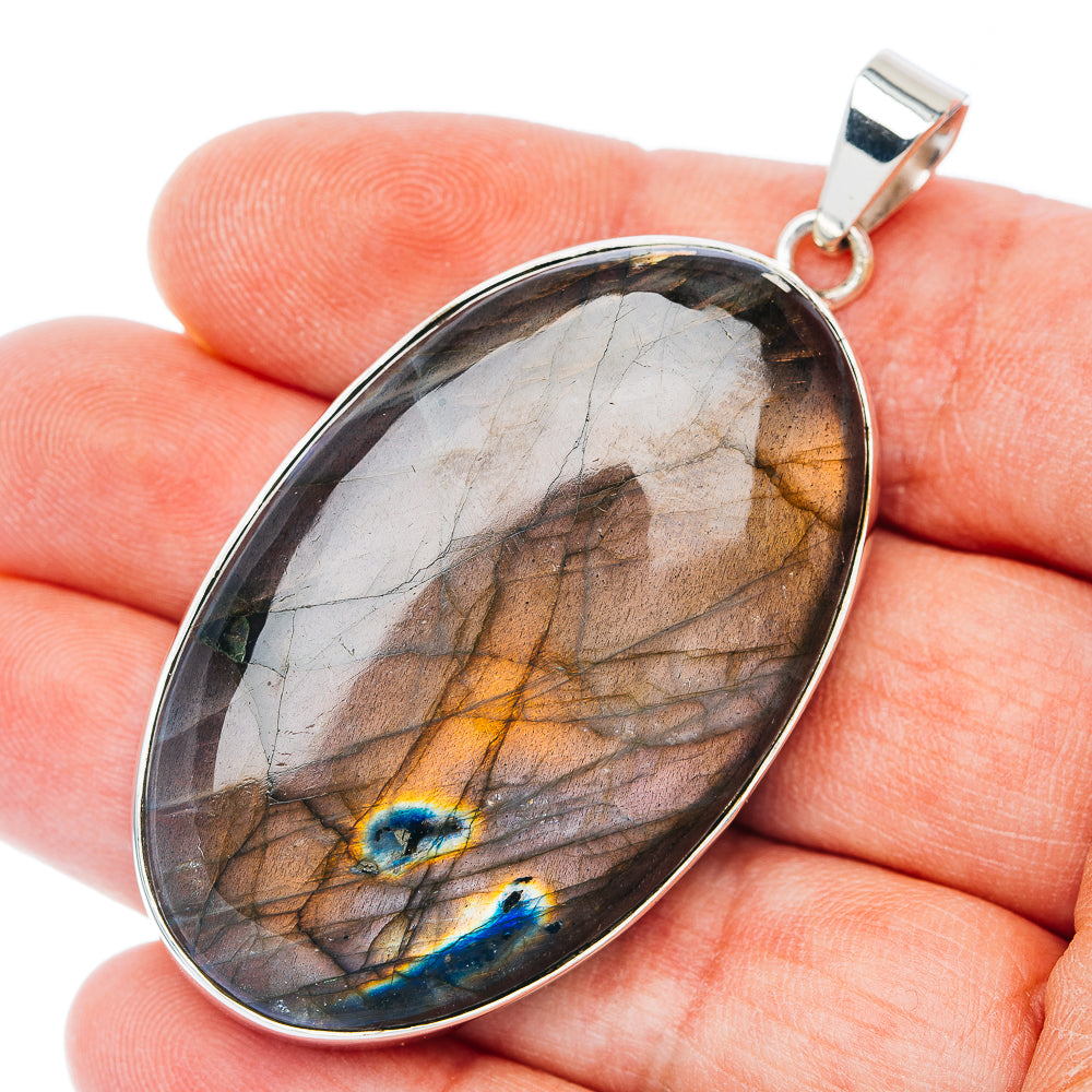 Oval spectrolite gemstone pendant in .925 sterling silver bezel, multicolor flash