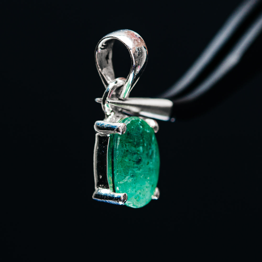 Green emerald pendant in .925 sterling silver with prongs and arched loop bail