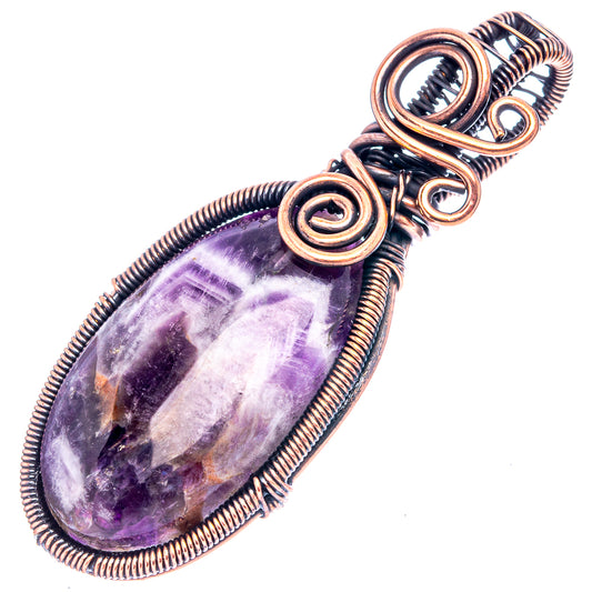 Amethyst teardrop pendant wire-wrapped in oxidized copper with spiral accents