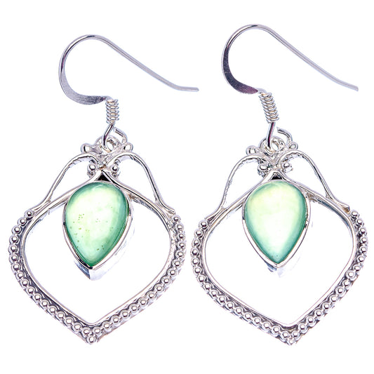 Sterling silver nephrite jade earrings with green teardrop stones in heart frames