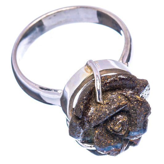 Sterling silver ring with dark rough stone top and blue opal-like flashes on band