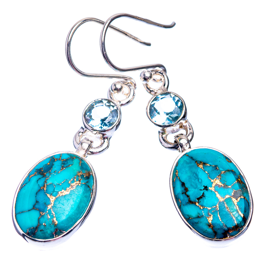 Turquoise oval drop earrings with blue round accents and sterling silver hooks