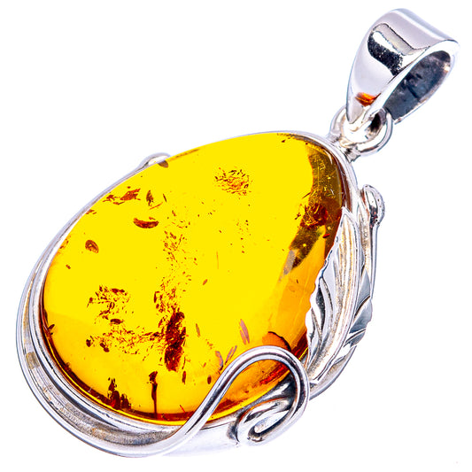 Yellow amber teardrop pendant with natural inclusions and silver frame, .925 sterling silver