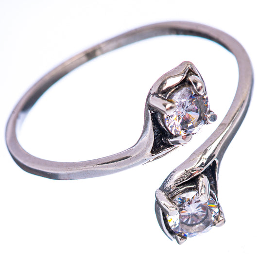 Silver cubic zirconia ring with two round stones, split band and prong settings