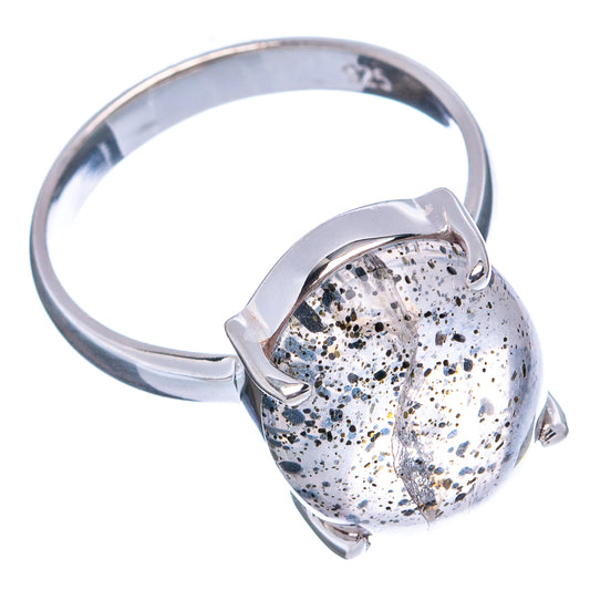 Sterling silver ring with oval rutilated quartz centerpiece, dark speckled surface and prongs