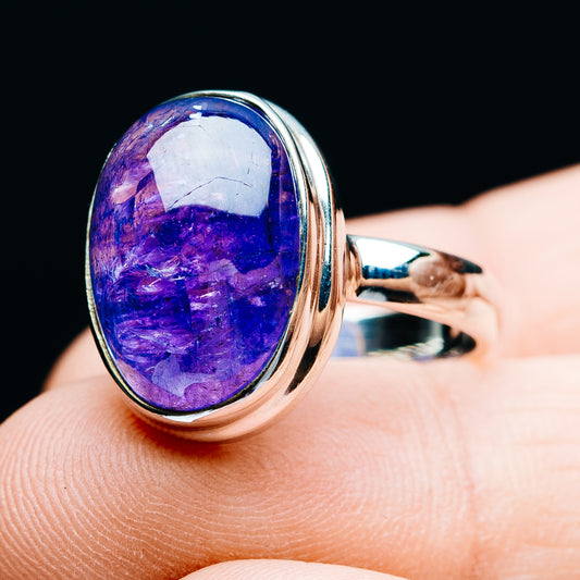 Oval blue-purple tanzanite set in .925 sterling silver ring, size 7