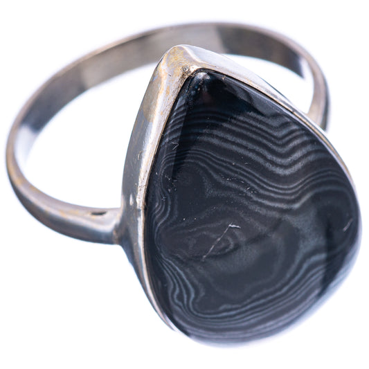 Sterling silver band ring with black striped teardrop stone in metal frame