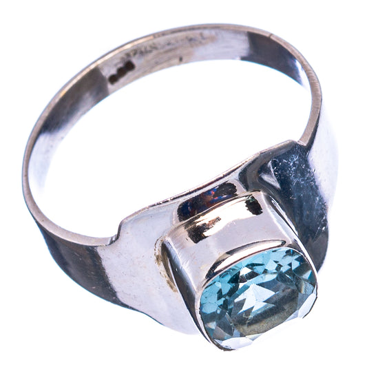 Sterling silver ring with oval blue topaz gemstone and wide band