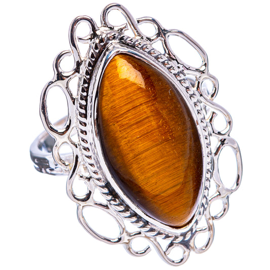 Sterling silver tiger's eye ring, oval amber-gold cabochon with decorative openwork band