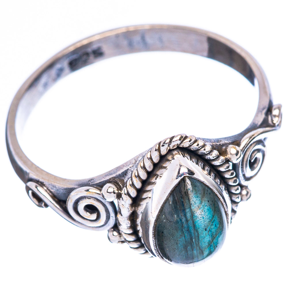 Sterling silver ring with oval labradorite cabochon, blue-green flash, and swirl setting