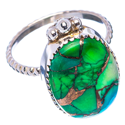 Sterling silver ring showing green turquoise oval cabochon with detailed gallery setting