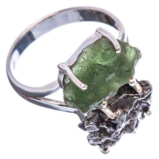 Sterling silver ring featuring a rough green gemstone and dark meteorite-style metal base