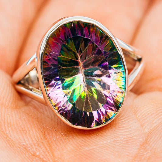 Sterling silver oval ring with rainbow-prismatic faceted gemstone, size 6.75