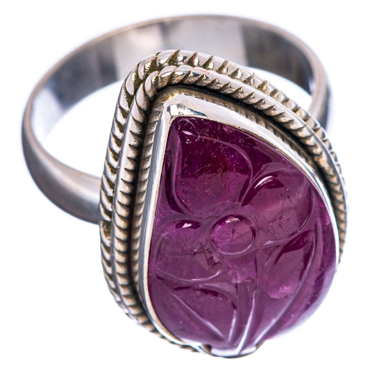 Sterling silver oval gemstone ring with purple carved ruby and rope-textured band, side view
