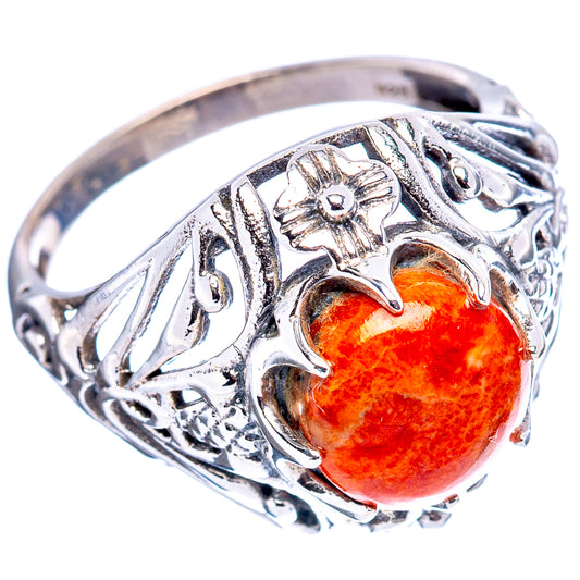 Sterling silver filigree ring with orange coral cabochon, floral details and openwork
