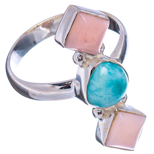Sterling silver ring side view with blue oval centerpiece and two pink rectangular stones