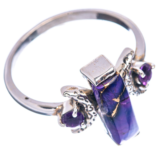 Silver-tone ring with purple gemstone center and small amethyst-colored accent stones