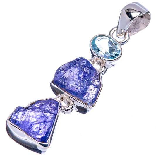 Sterling silver pendant with blue topaz center and three purple rough tanzanite stones